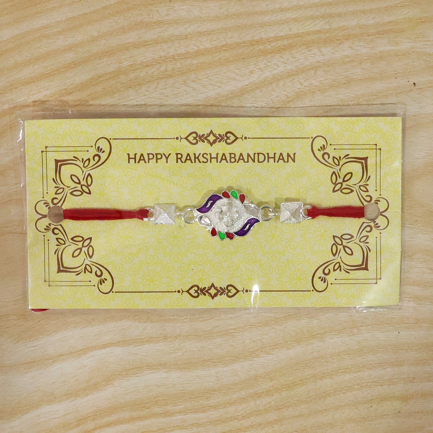 Beautifully crafted Silver Ganesha Rakhi in pyramid bead style