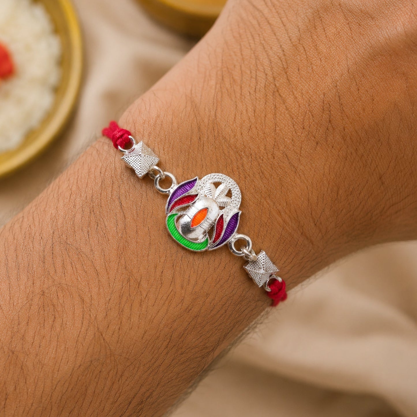 Close-up of Silver Shivling Rakhi design featuring spiritual Shivling motif