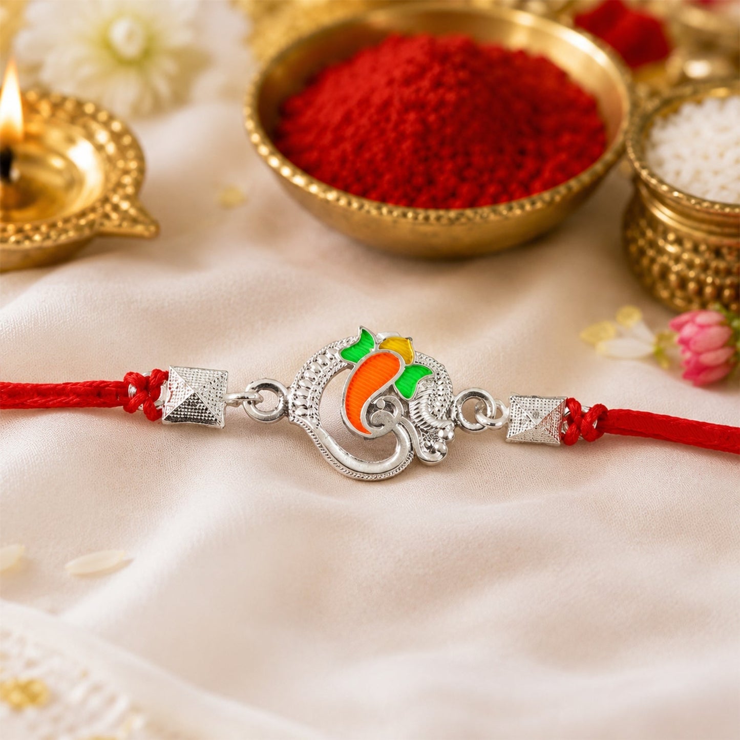 Traditional Silver Om Ganesha Rakhi with festive design