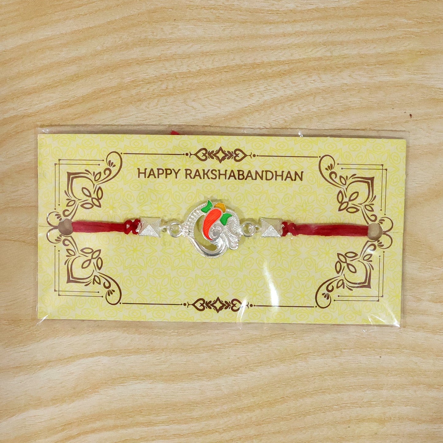 Festive Silver Om Ganesha Rakhi suitable for Raksha Bandhan celebrations