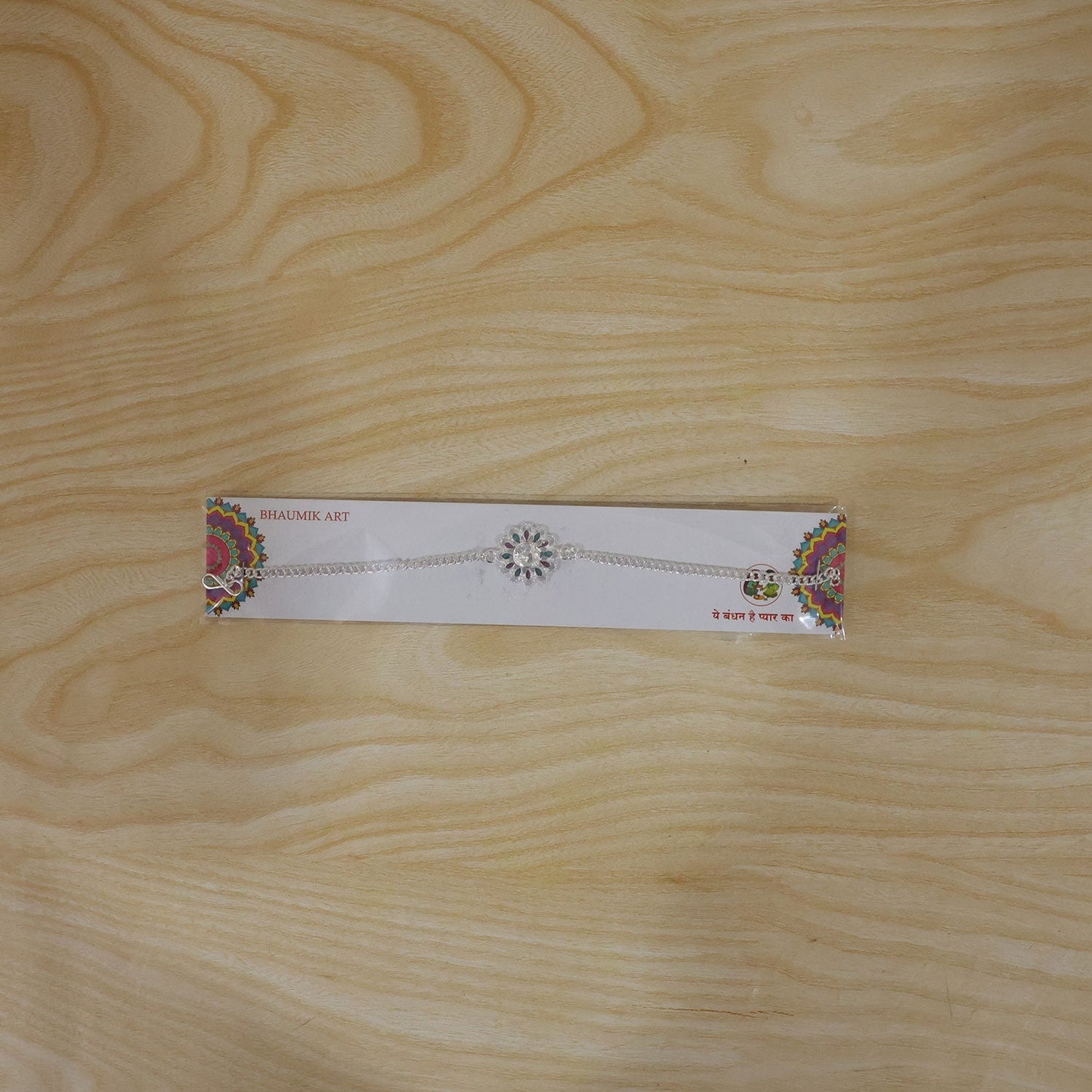 Detailed look at Silver floral Om enamel bracelet for Rakhi