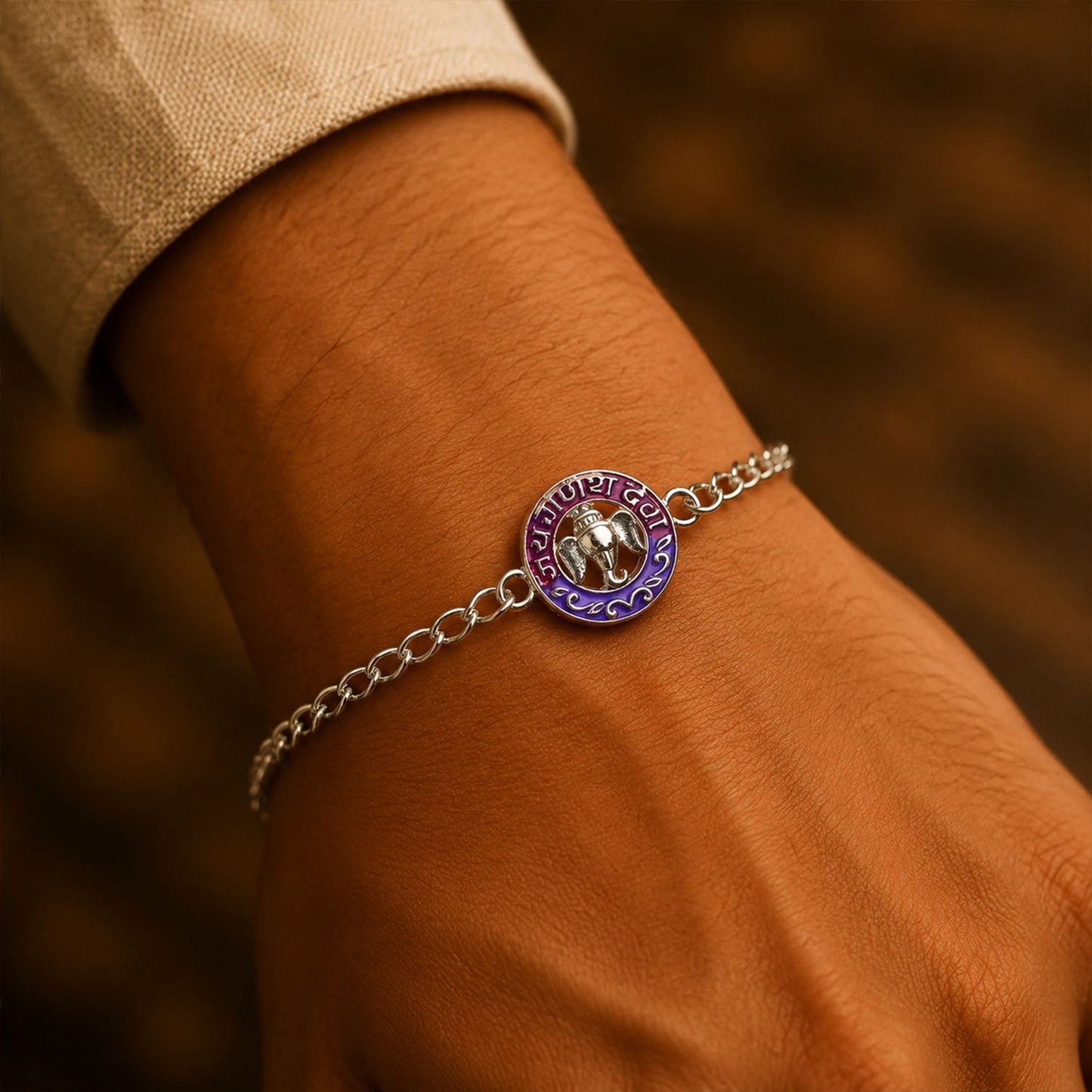 Close-up of silver Ganesha enamel bracelet with intricate details