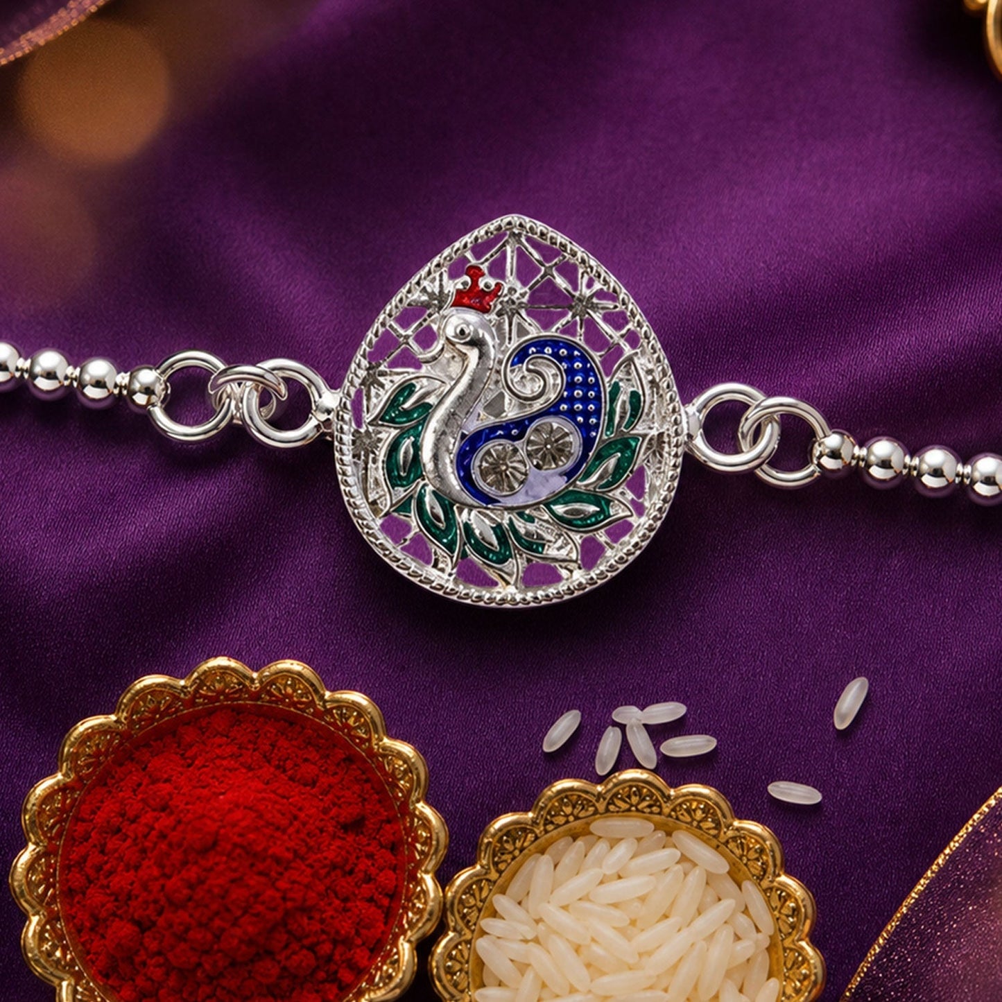 Vibrant peacock enamel design on a delicate chain bracelet for festive jewelry
