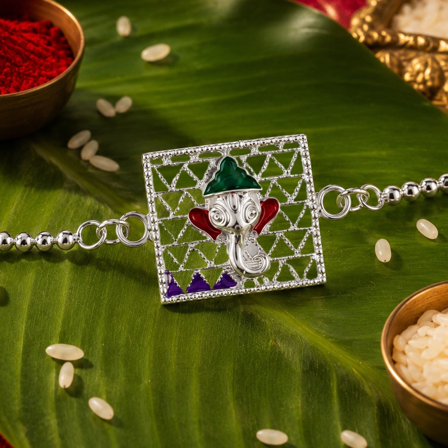Close-up of Silver Ganesha enamel rakhi showcasing intricate work