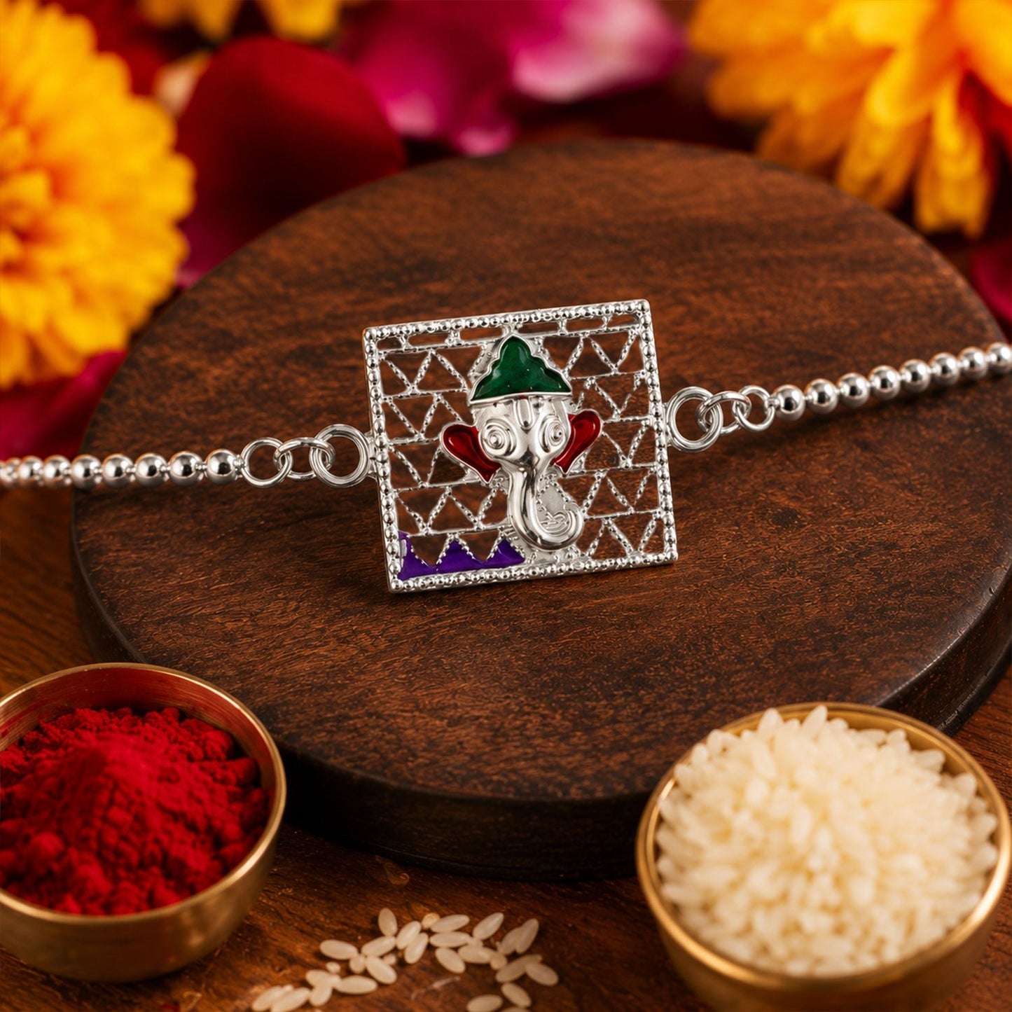 Elegant Silver Ganesha rakhi with colorful enamel detailing