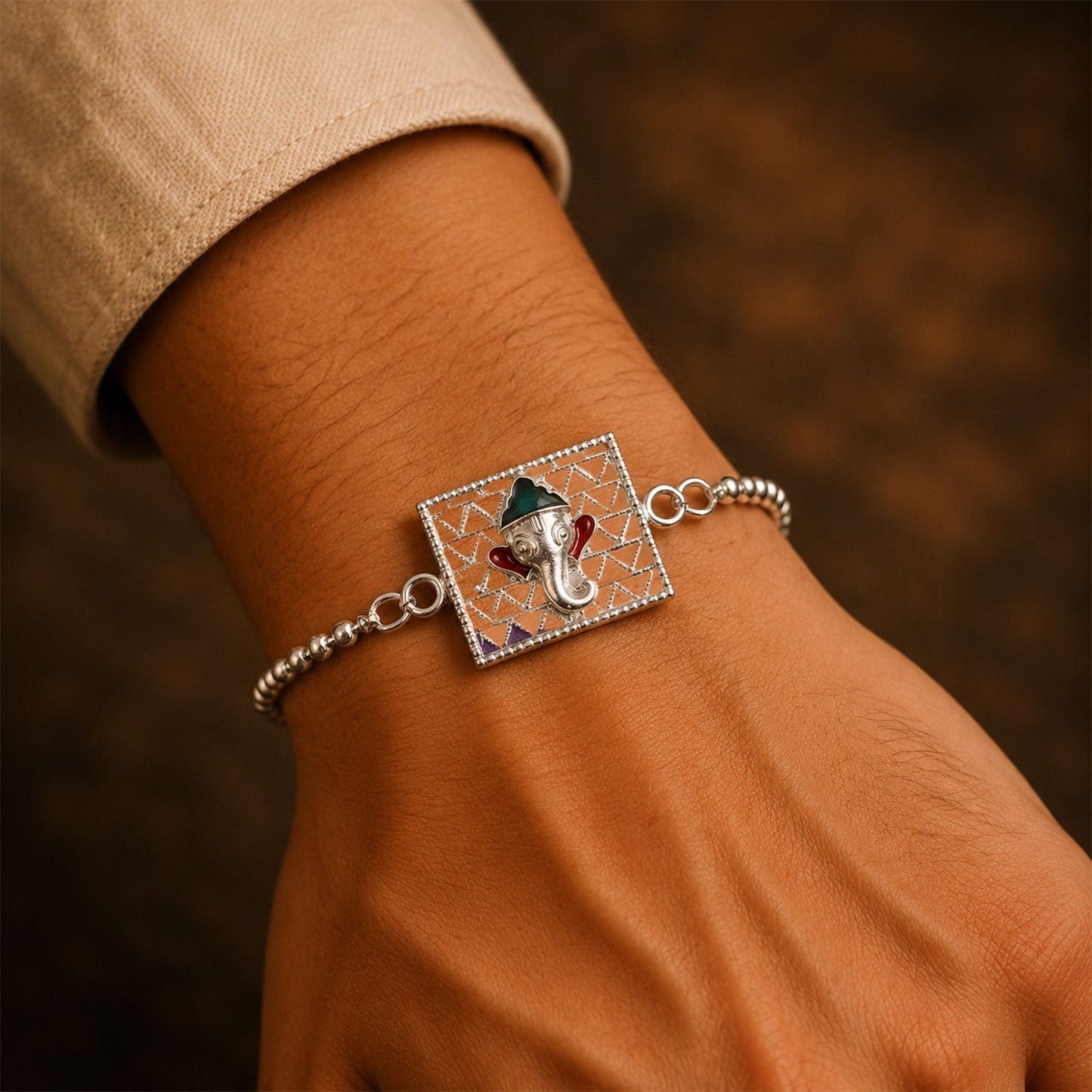 Beautiful Silver Ganesha enamel rakhi prepared for Raksha Bandhan