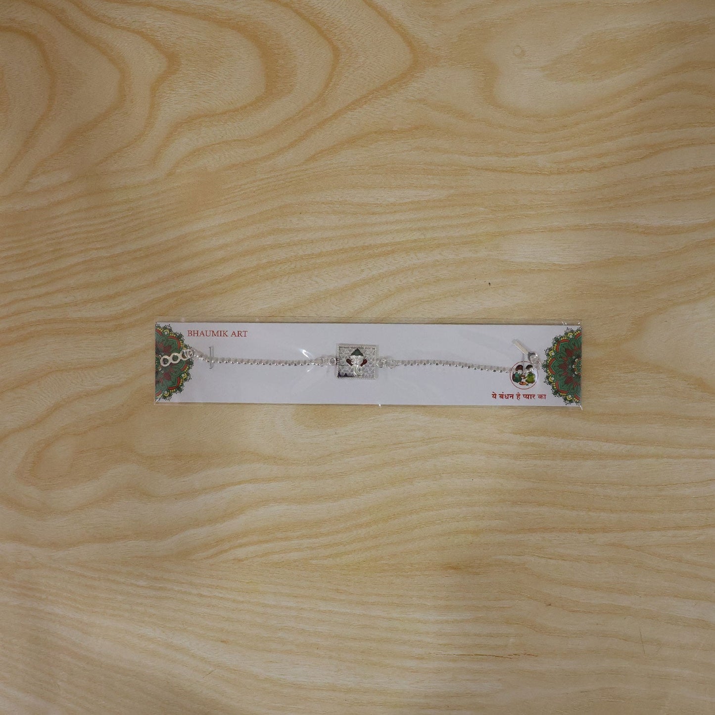 Stylish Silver Ganesha enamel rakhi on display for festival celebration