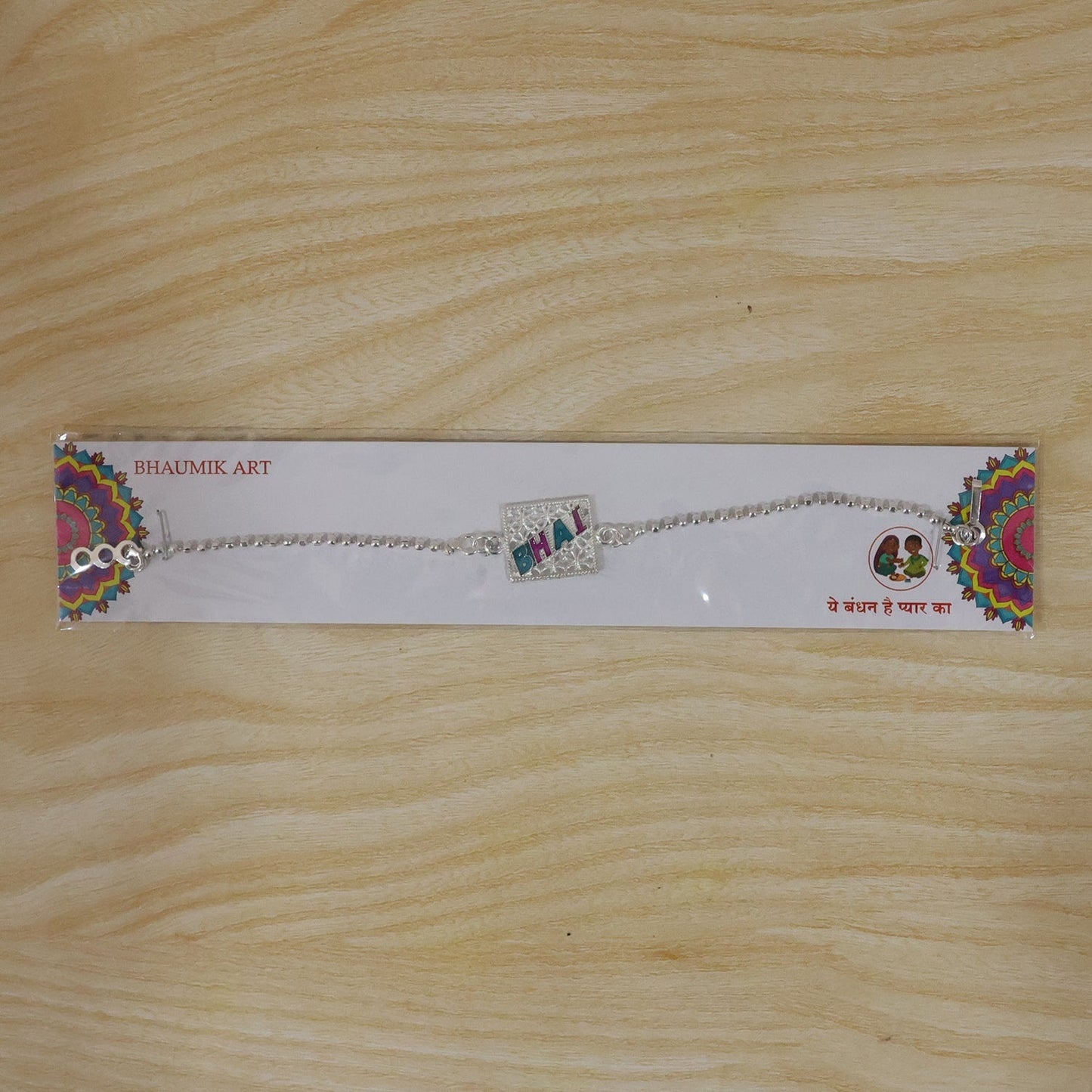 Festive Rakhi for brother with enamel charm, perfect for Raksha Bandhan