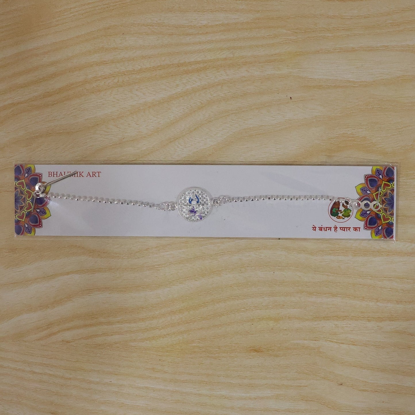 Beautifully crafted Mahakal Trishul Rakhi in vibrant colors
