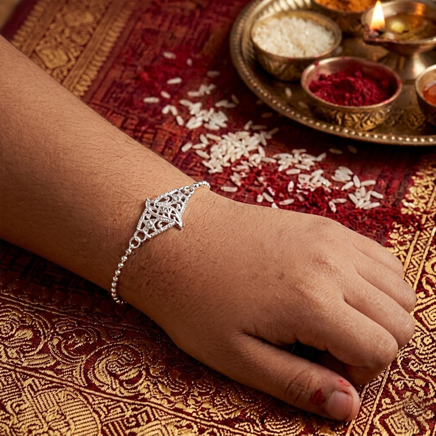 Stylish leaf-shaped Rakhi with sparkling stones, perfect for Raksha Bandhan