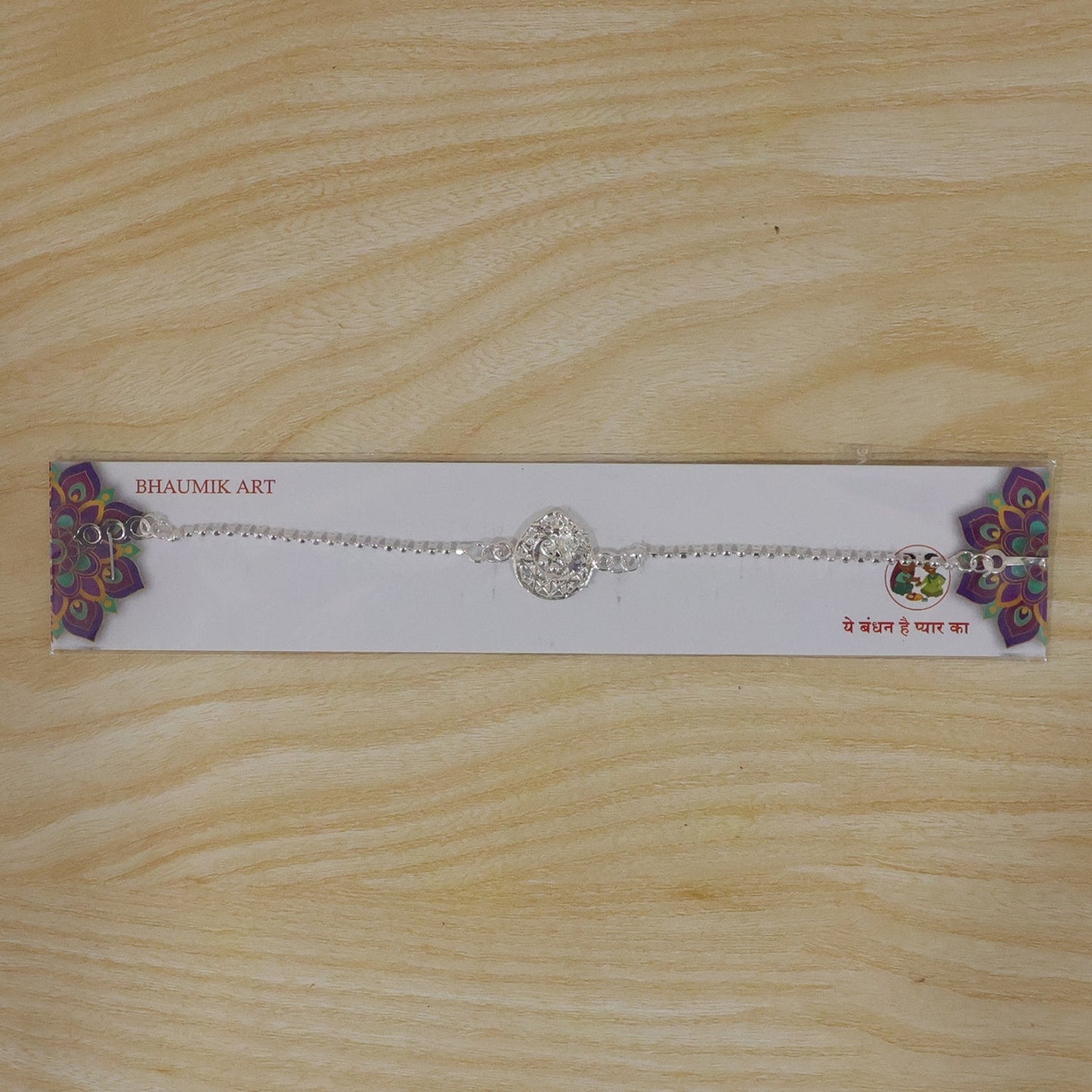 Vibrant peacock enamel charm Rakhi perfect for Raksha Bandhan