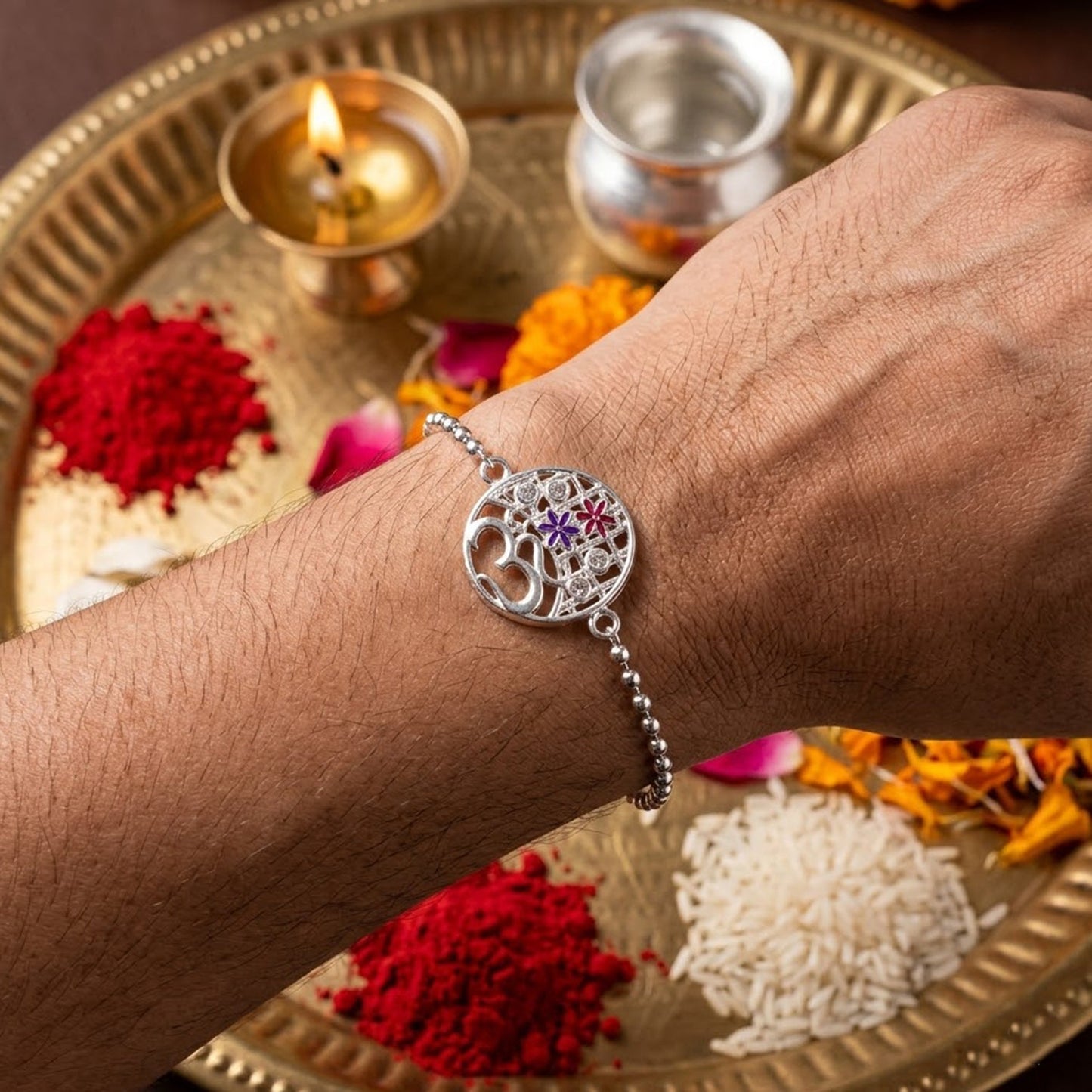 Elegant floral design Rakhi featuring Om symbol, suitable for brothers of all ages
