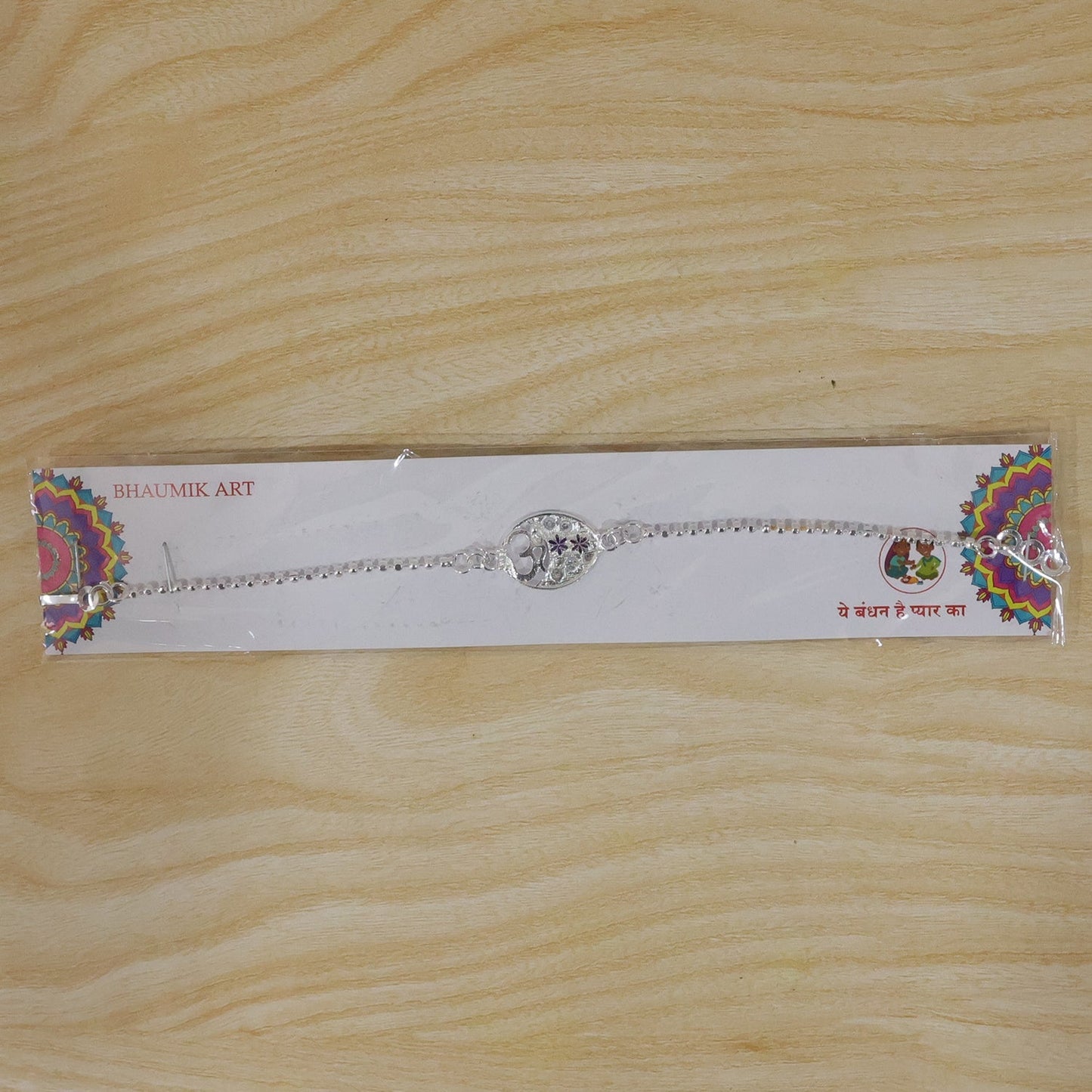 Beautiful floral Rakhi with Om symbol, suitable for brothers of all ages