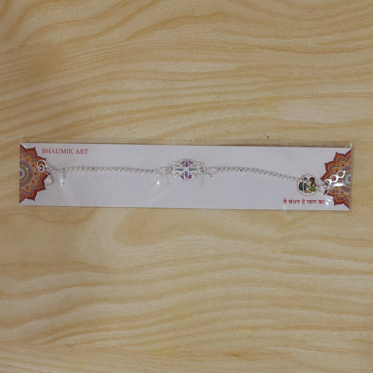 Colorful enamel stone charm chain bracelet rakhi for Raksha Bandhan celebrations.
