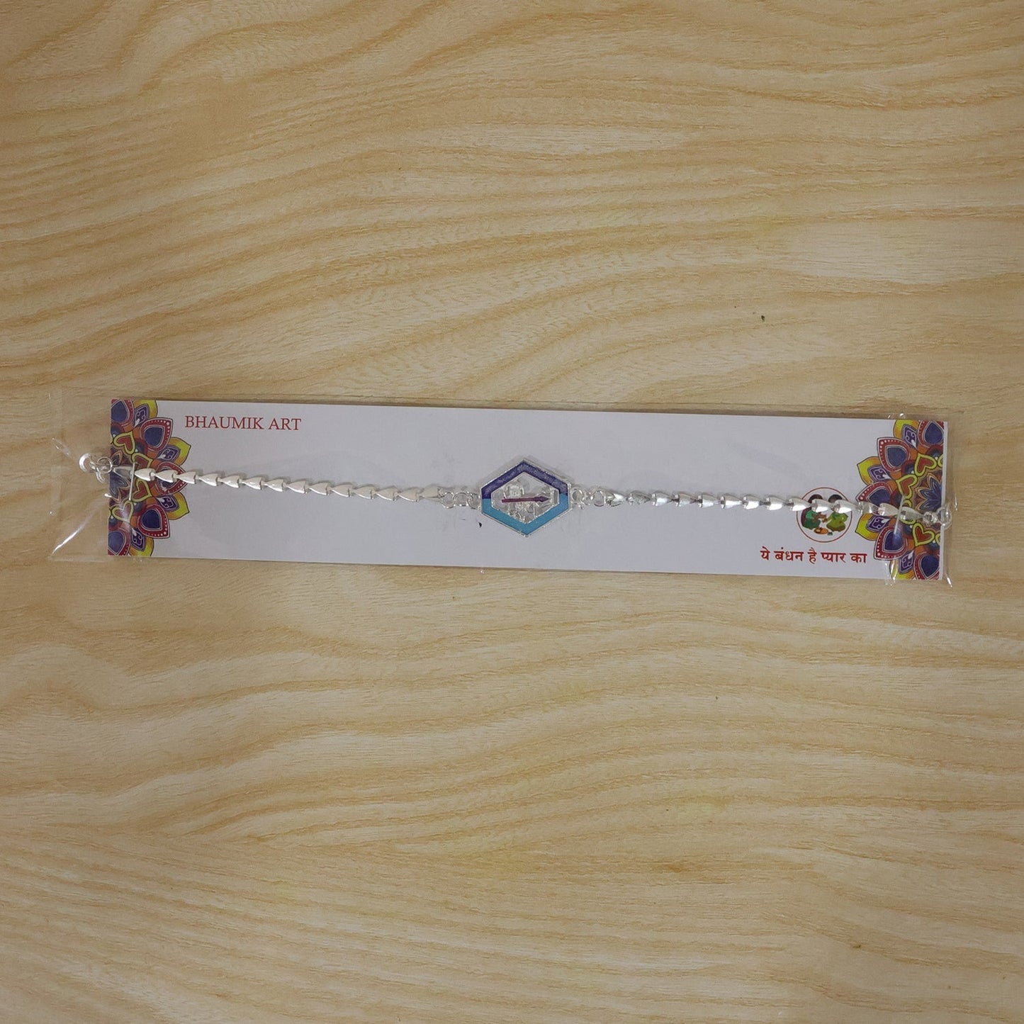 Beautiful Shiva enamel charm Rakhi for brother with intricate design