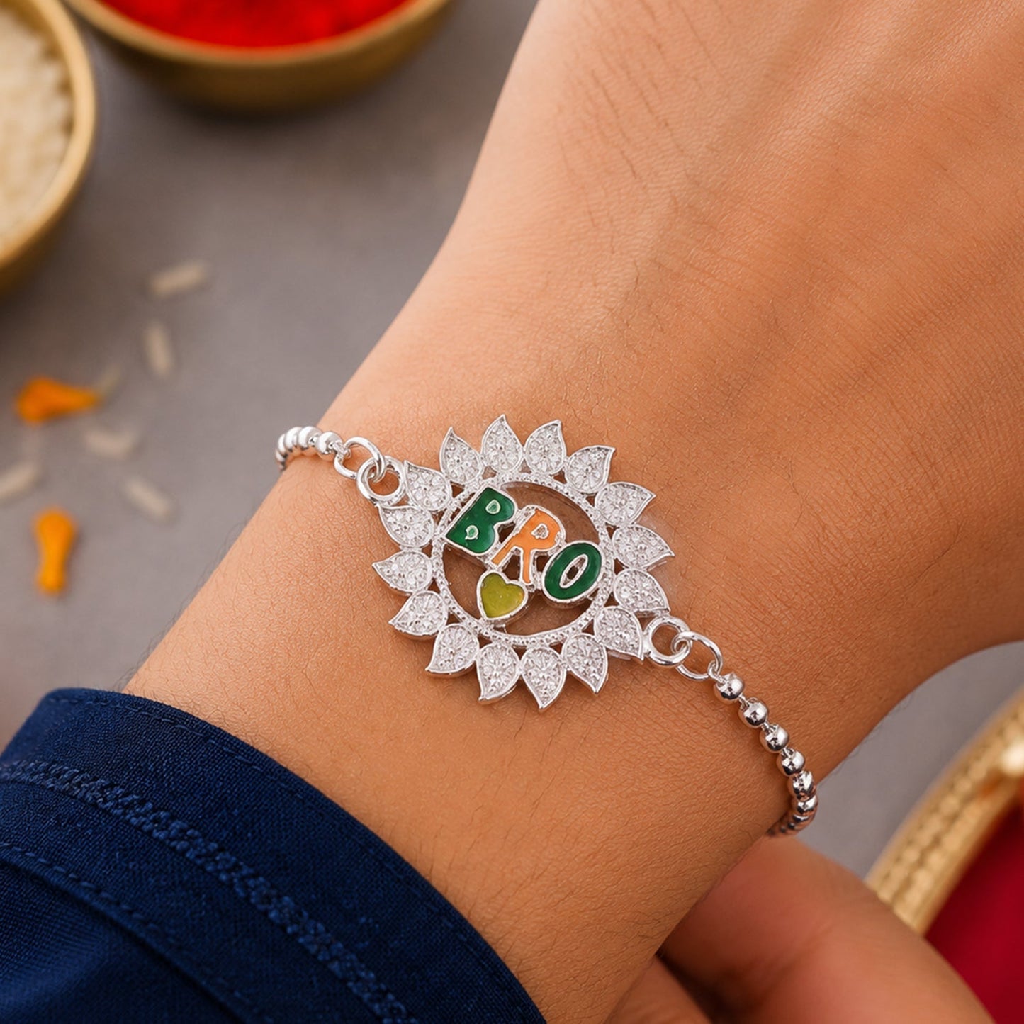 Vibrant flower-studded Rakhi with decorative stones