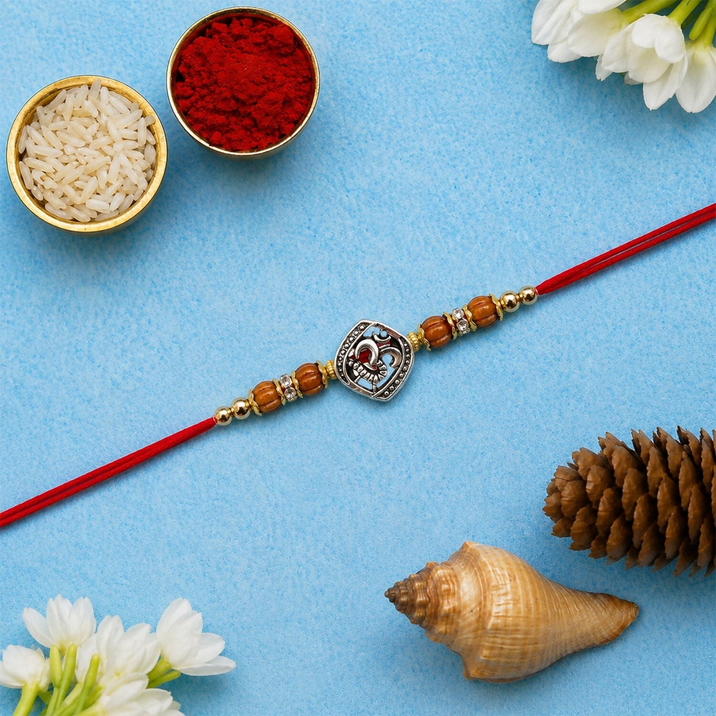 Side view of the beaded Om Rakhi, highlighting craftsmanship.