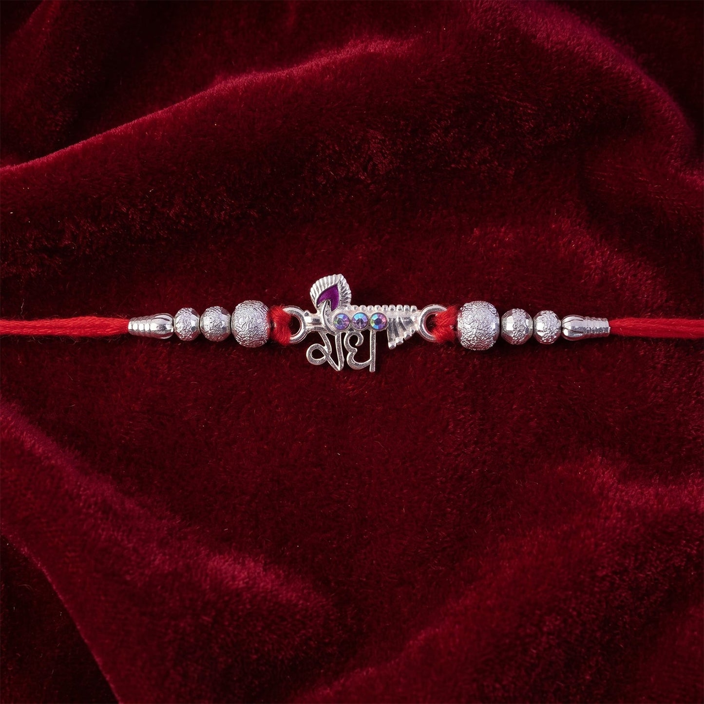 Side view of Radhe Silver Rakhi highlighting its neat finish.