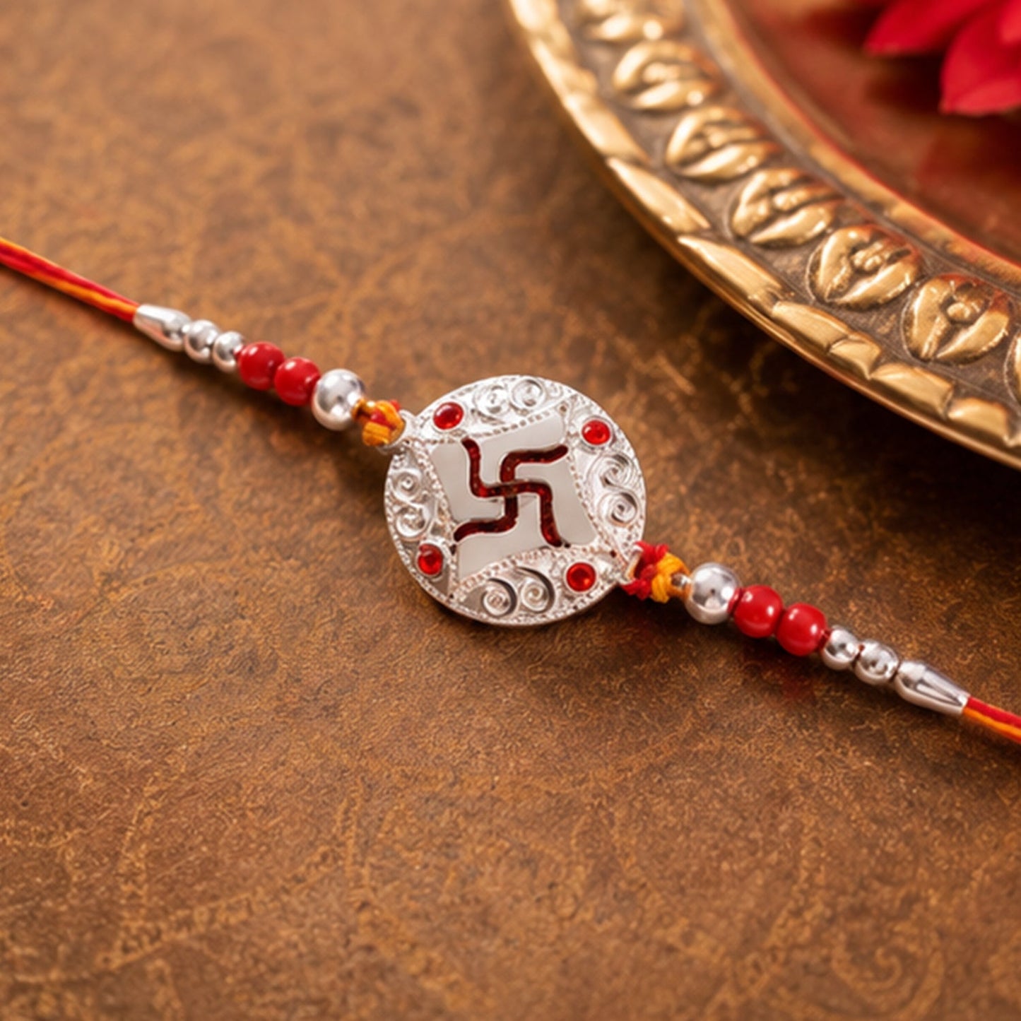Side angle of decorative bead details on rakhi