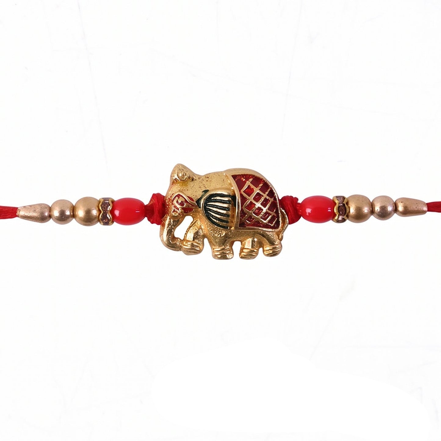 Gold elephant rakhi with neat finish featuring red beads and pearls