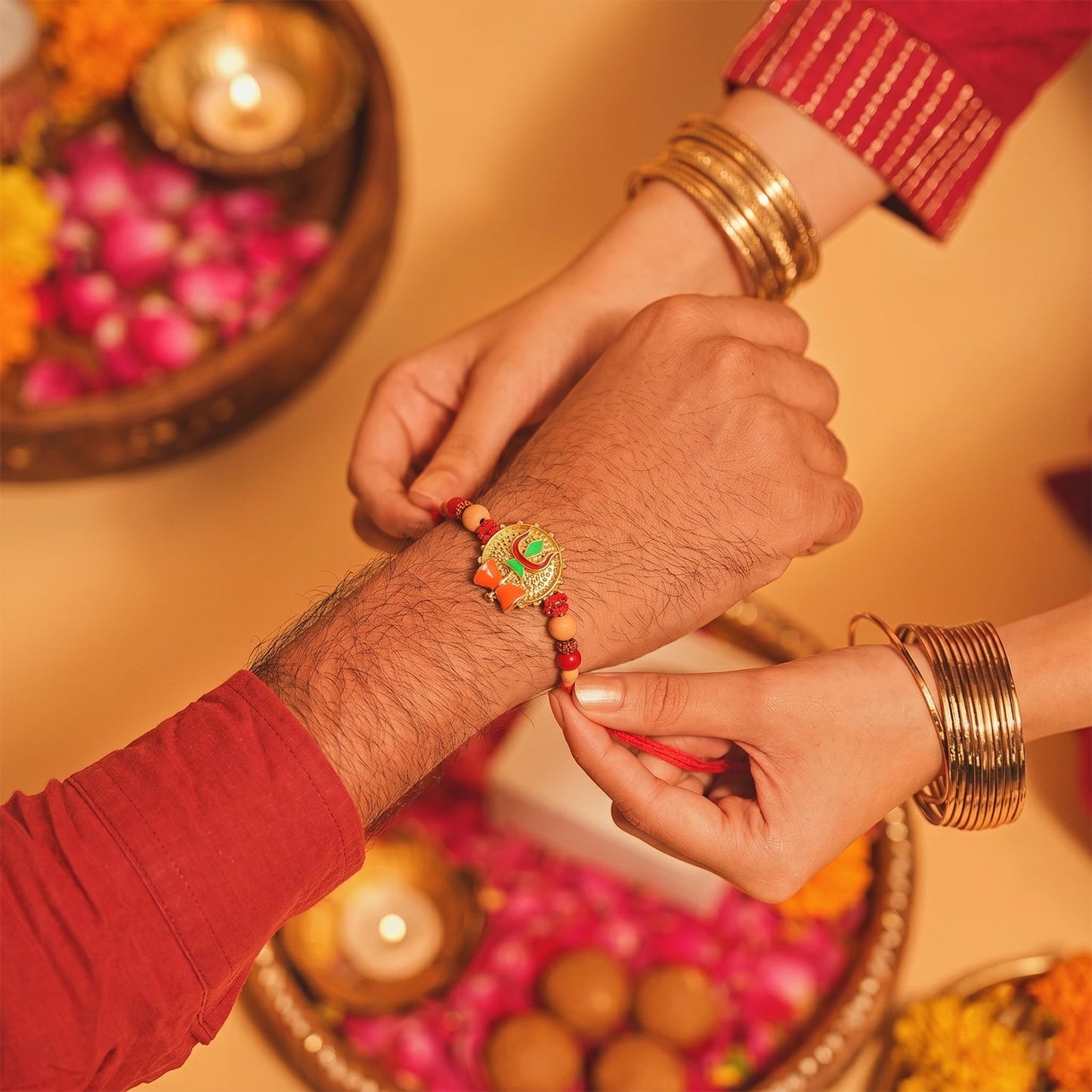 Close-up of peach beads on Trishul Damru Rakhi
