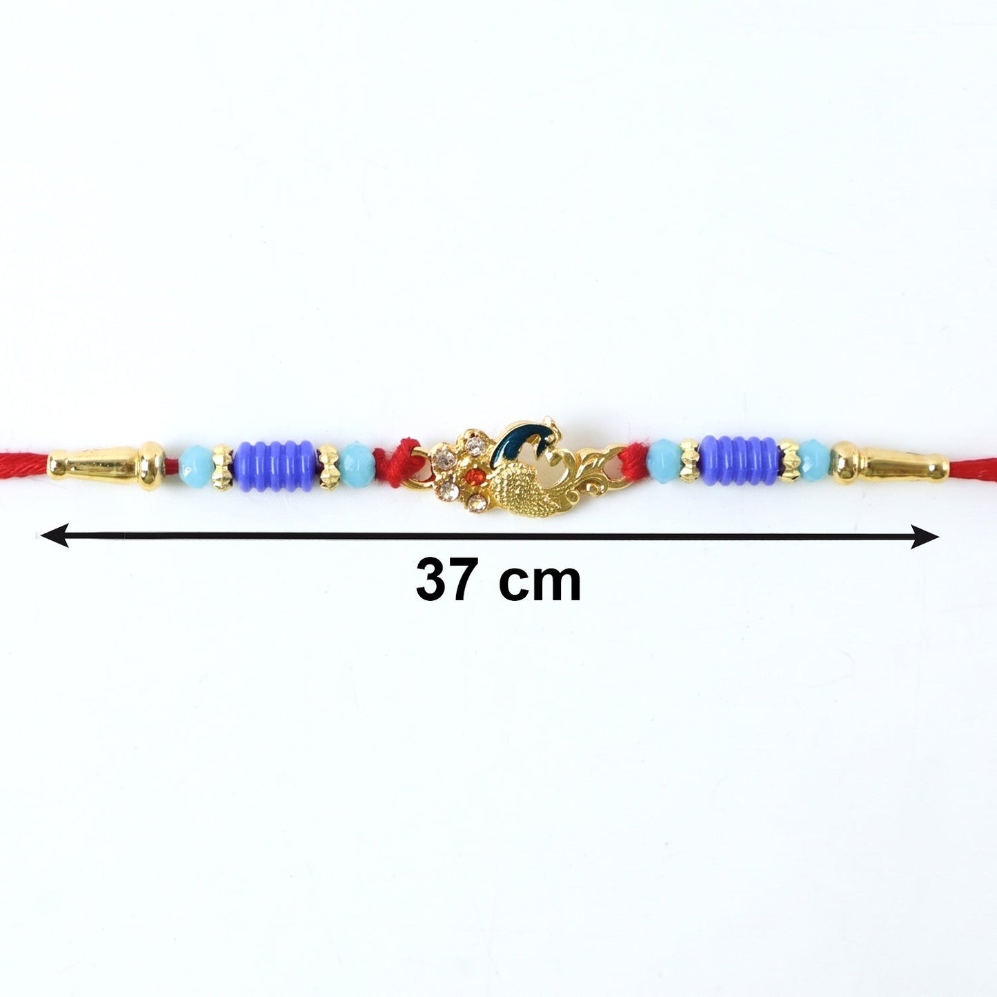 Hand holding the soft-threaded peacock Rakhi demonstrating comfort
