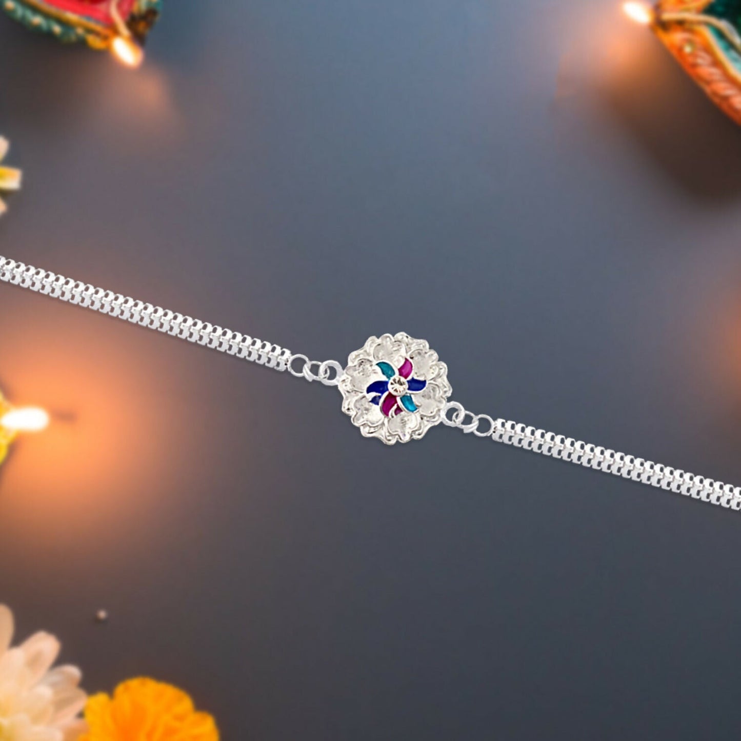 Side view of the elegant silver floral Rakhi, highlighting its craftsmanship.